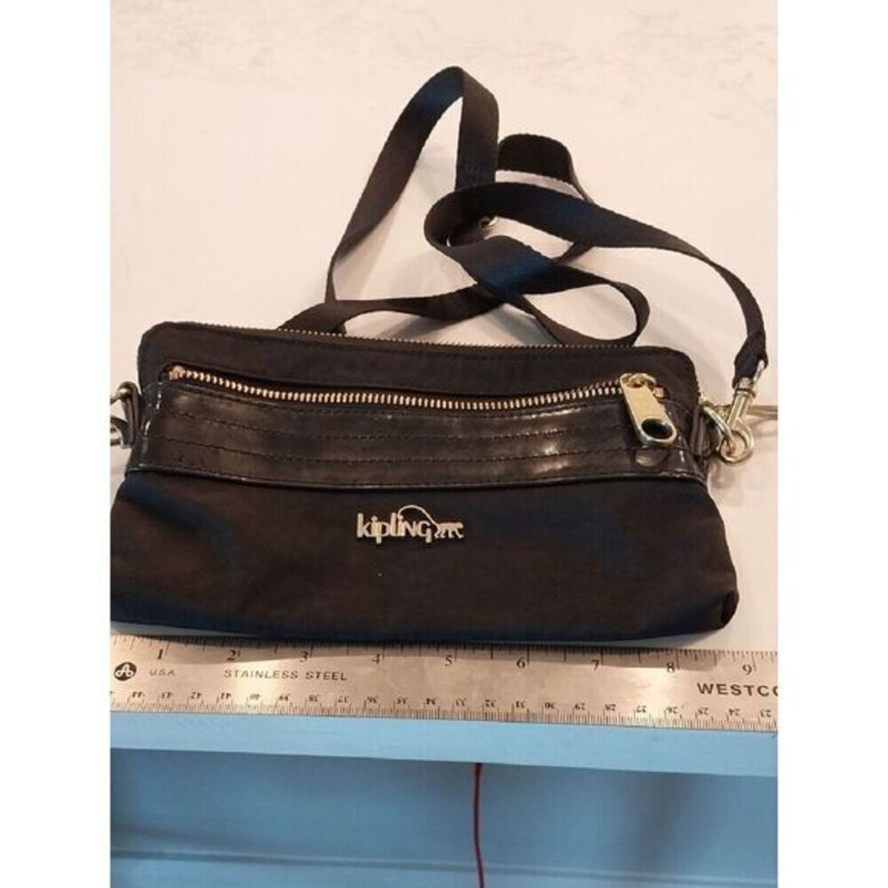 Kipling Black Crossbody with Gold Accent Logo...Almost New Condition.
